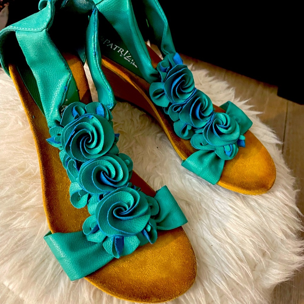 Cute teal wedge sandals.
